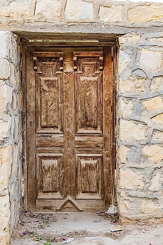Faiyum-Egypt Wooden door in a wall Art Print